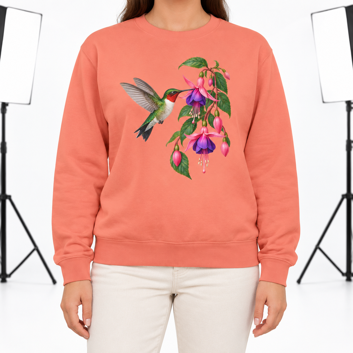 Woman wearing the Ruby-throated Hummingbird & Fuchsia sweatshirt in Terracotta