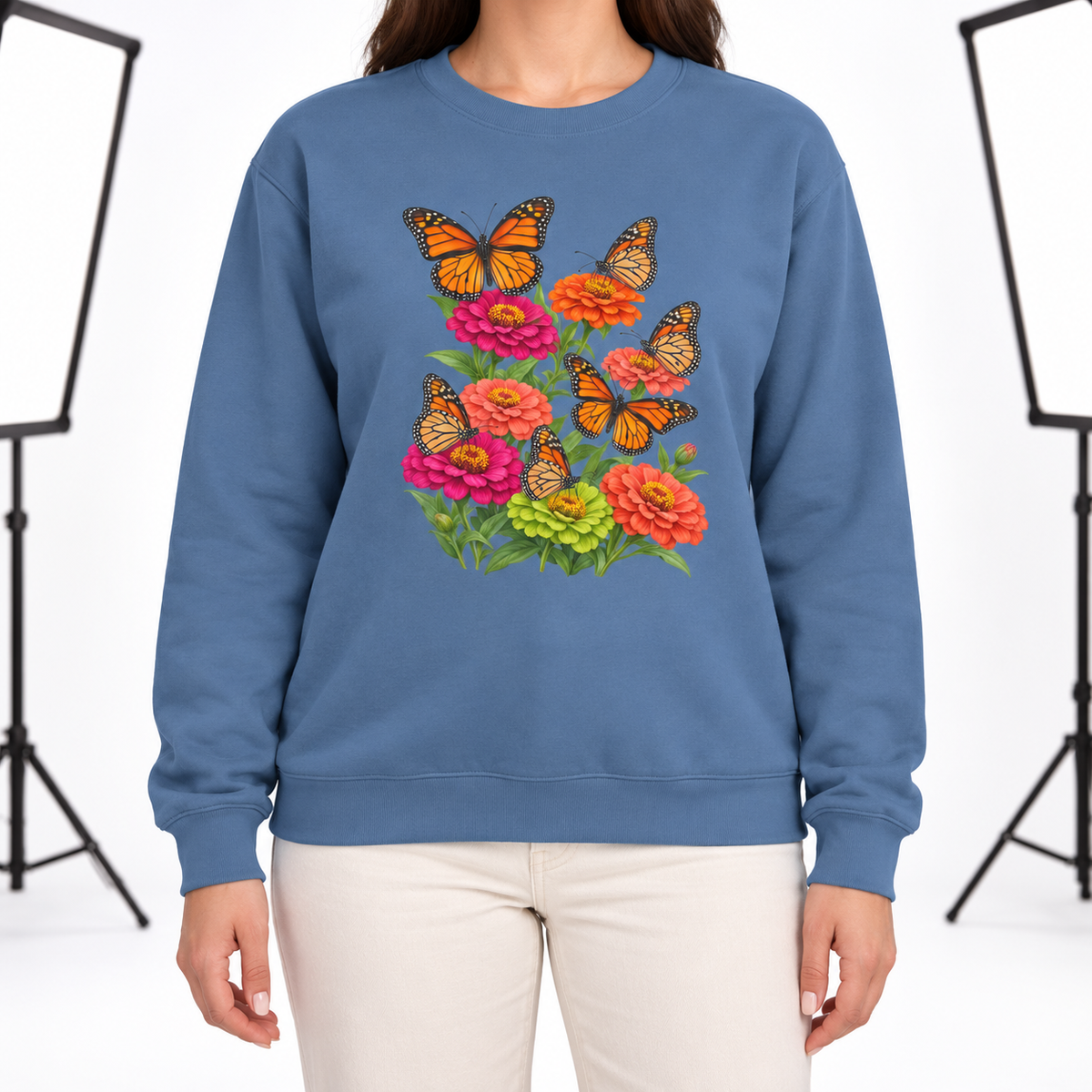 Woman wearing the Six Monarchs & Blooming Zinnias sweatshirt in Blue Jean