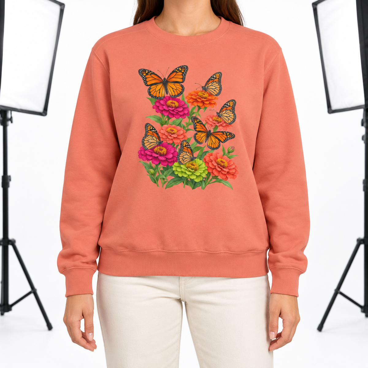 Woman wearing the Six Monarchs & Blooming Zinnias sweatshirt in Terracotta
