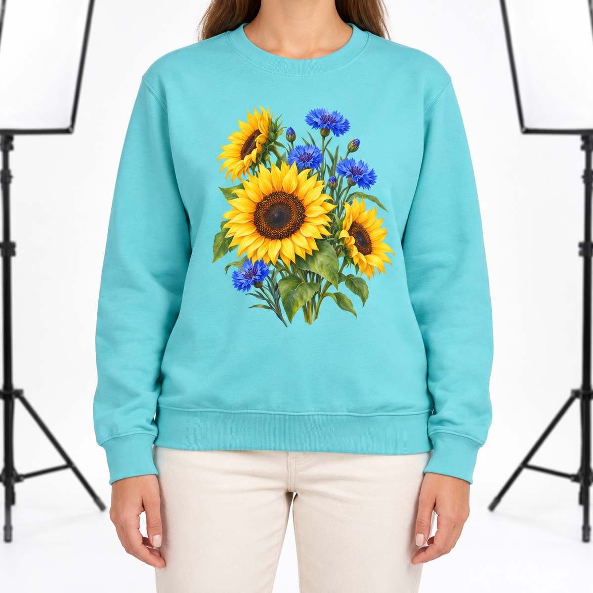 Woman wearing the Golden Sunflowers & Cobalt Cornflowers sweatshirt in Chalky Mint