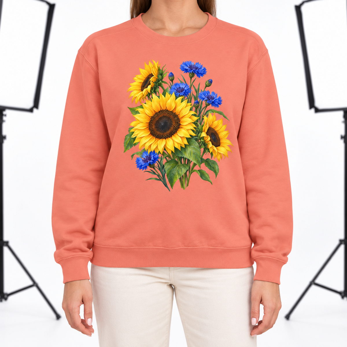 Woman wearing the Golden Sunflowers & Cobalt Cornflowers sweatshirt in Terracotta