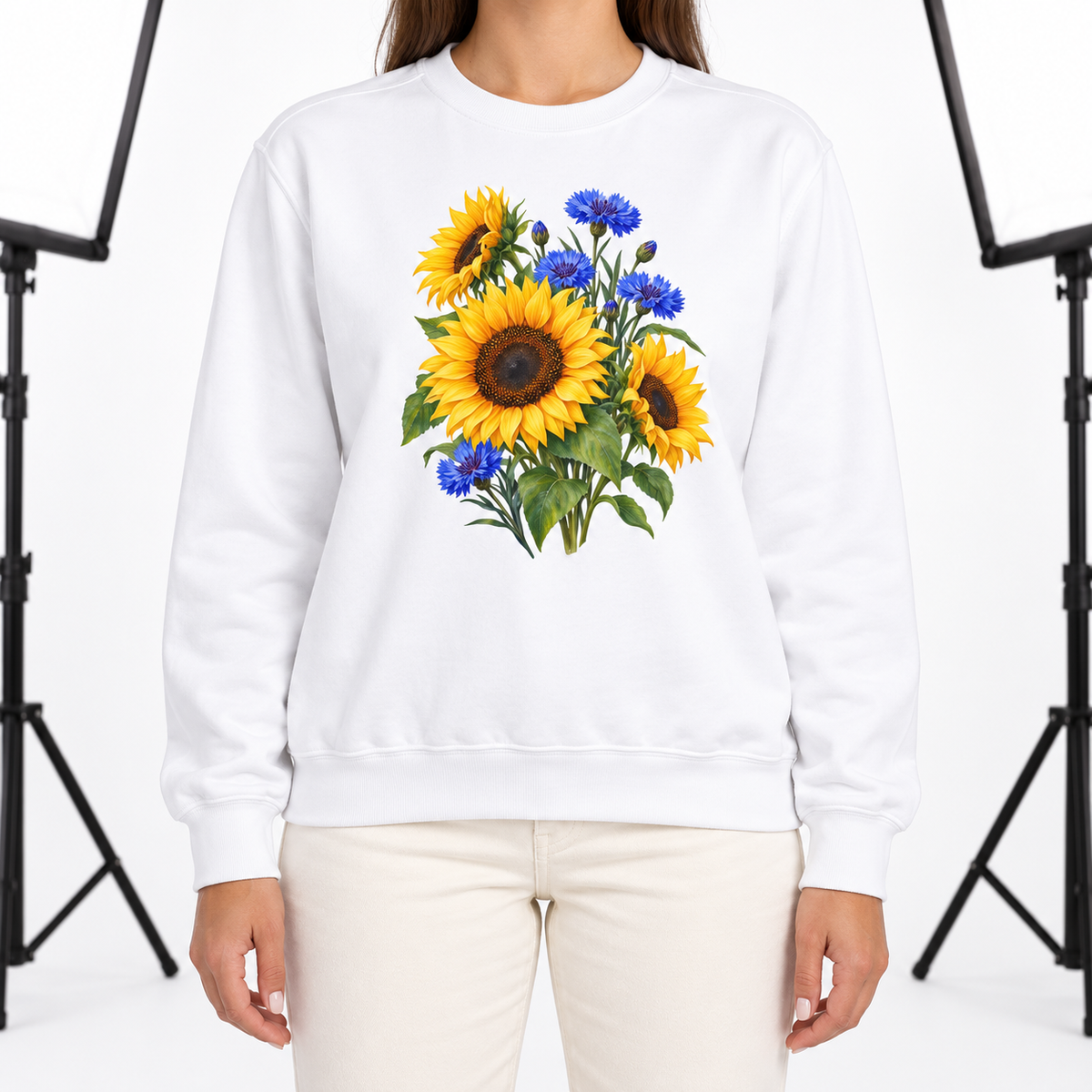 Woman wearing the Golden Sunflowers & Cobalt Cornflowers sweatshirt in White