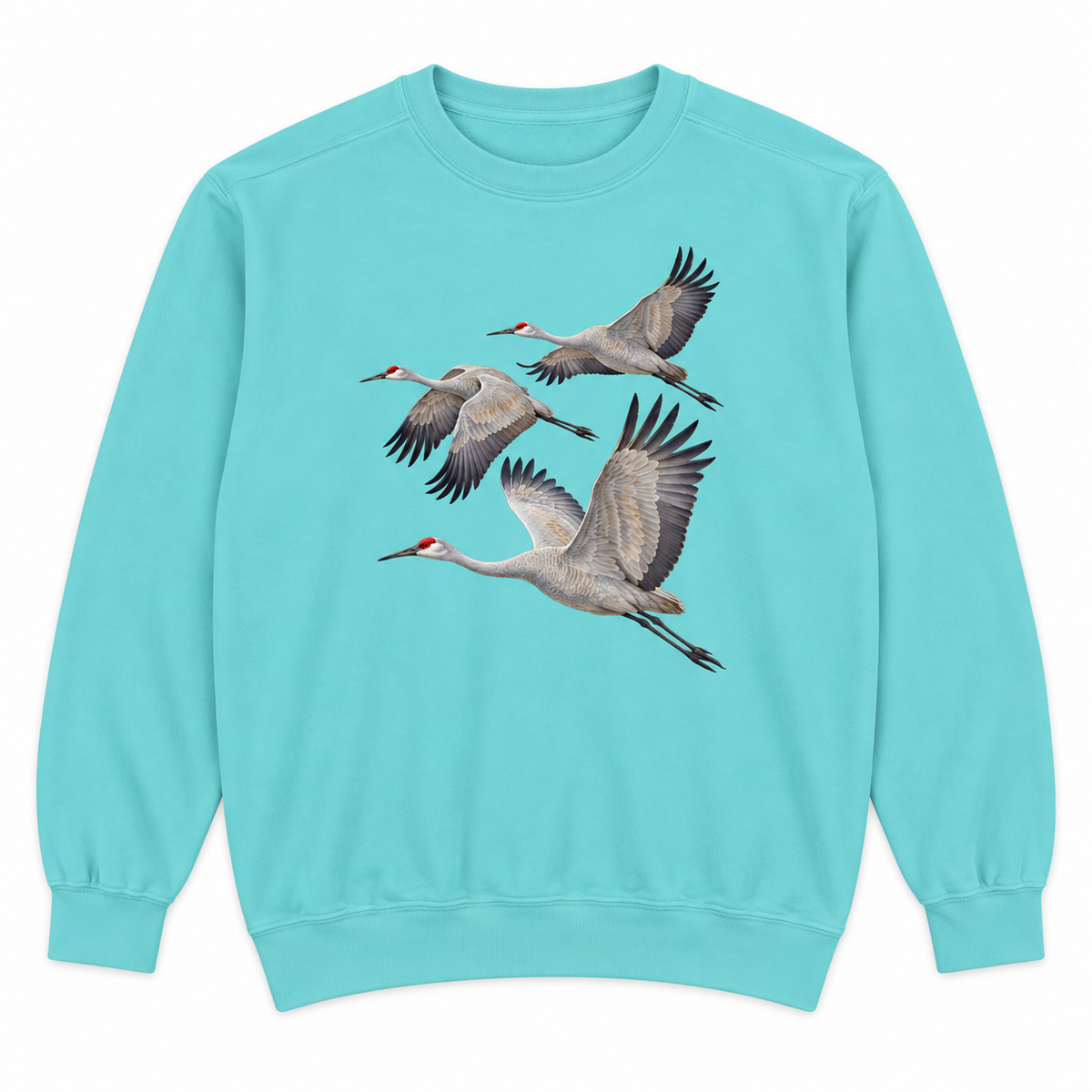 Front view of a Chalky Mint Comfort Colors 1566 crewneck sweatshirt with three sandhill cranes in flight printed on the chest, no text, laid flat