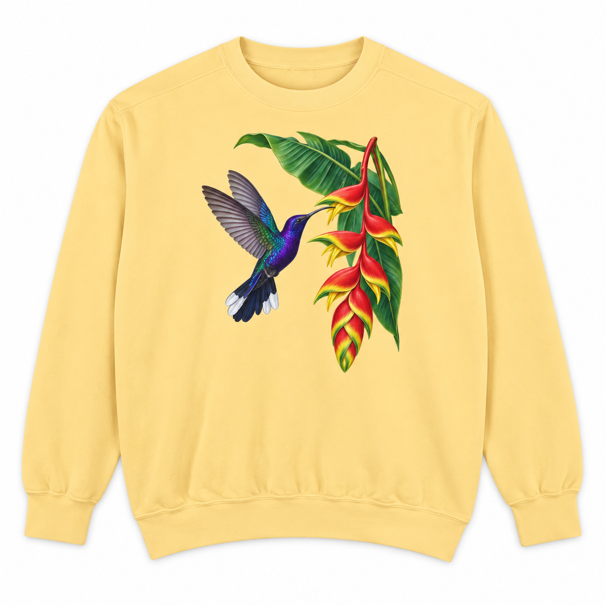 Woman wearing the Violet Sabrewing Hummingbird & Heliconia sweatshirt in Butter, a violet hummingbird feeding at a hanging red and yellow lobster-claw heliconia, large centered chest print