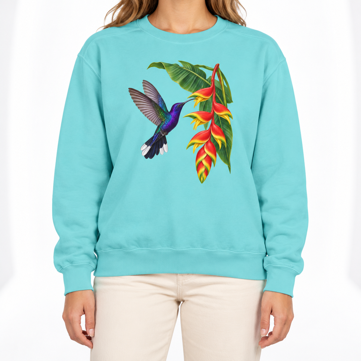 Woman wearing the Violet Sabrewing Hummingbird & Heliconia sweatshirt in Chalky Mint
