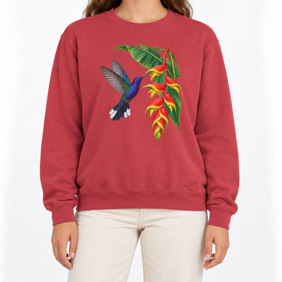 Woman wearing the Violet Sabrewing Hummingbird & Heliconia sweatshirt in Crimson