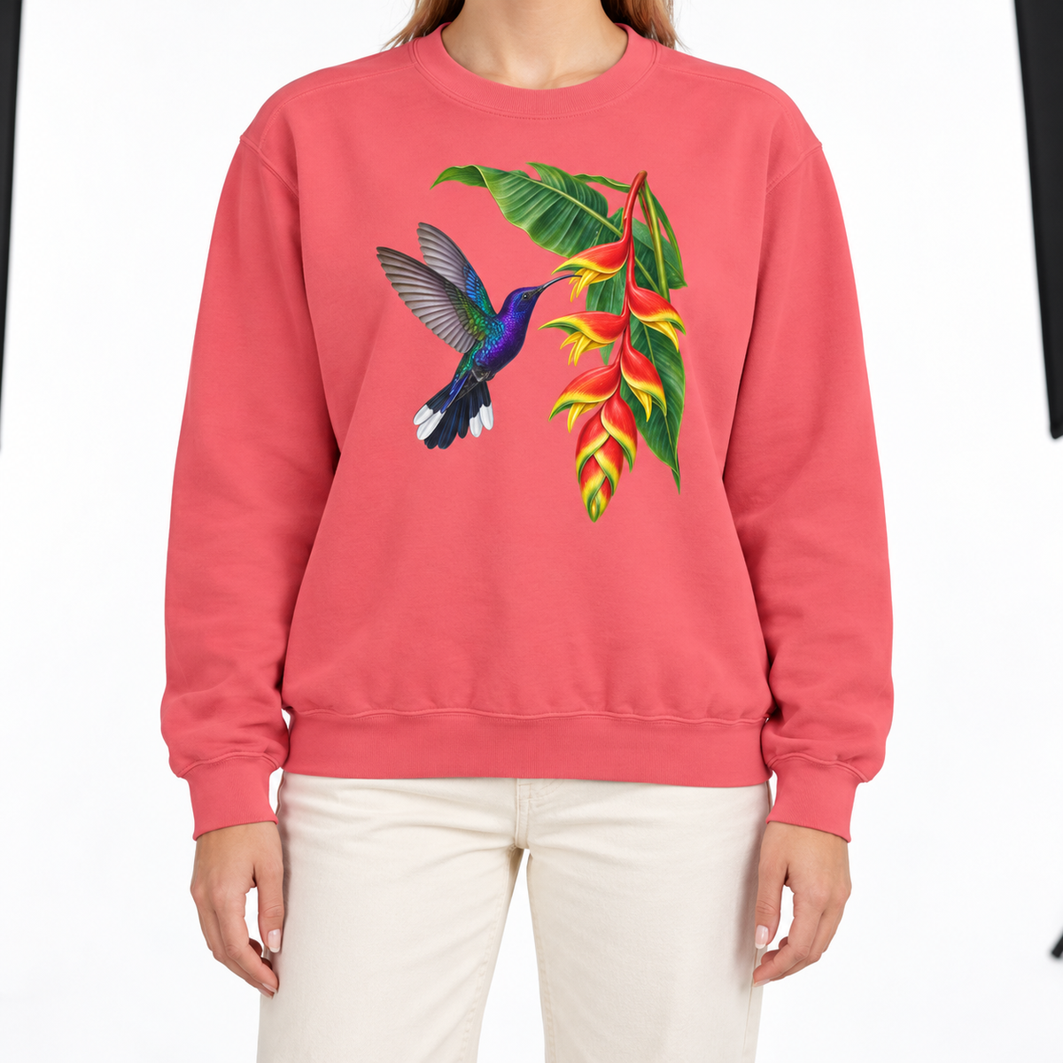 Woman wearing the Violet Sabrewing Hummingbird & Heliconia sweatshirt in Watermelon
