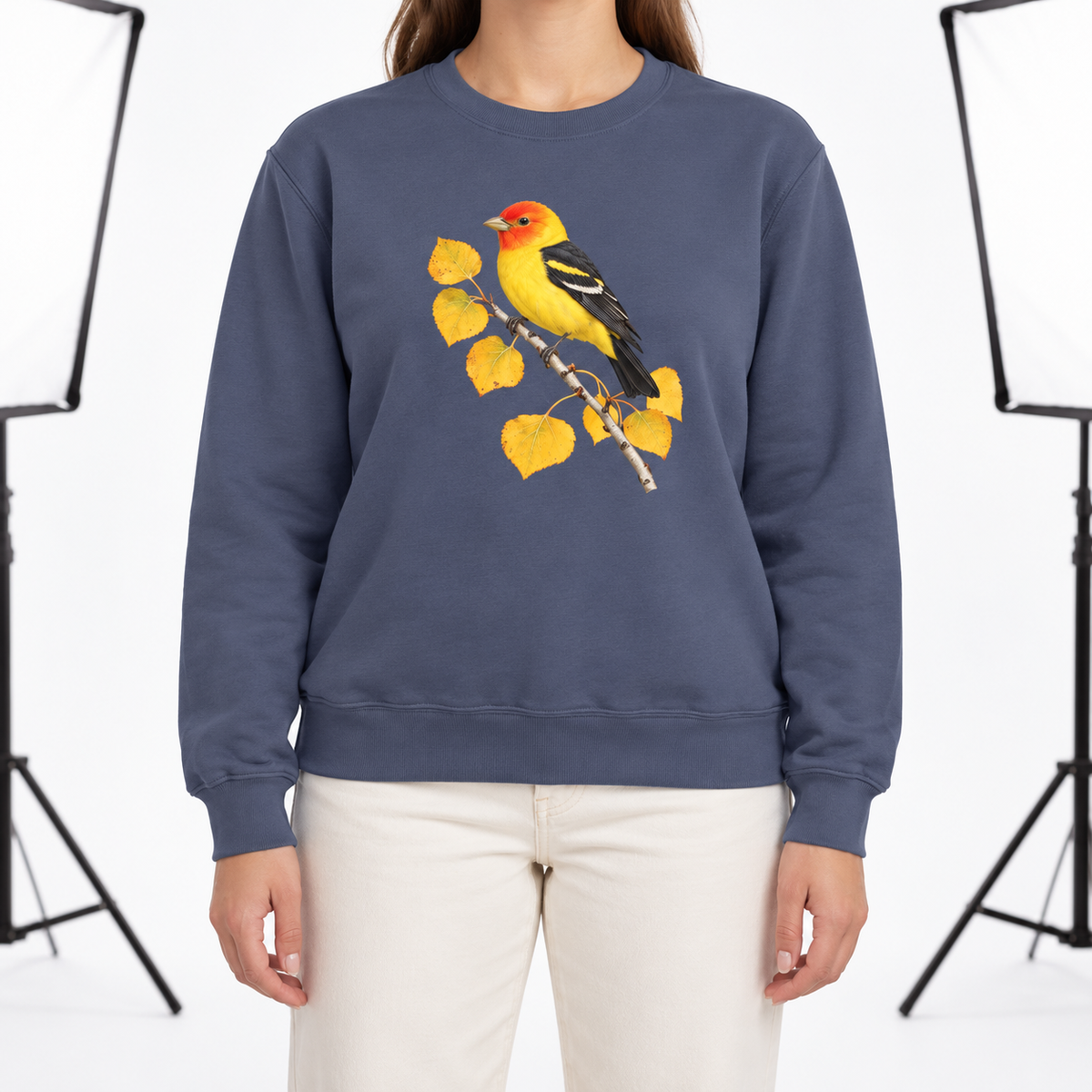 Woman wearing the Western Tanager on Golden Aspen sweatshirt in Denim
