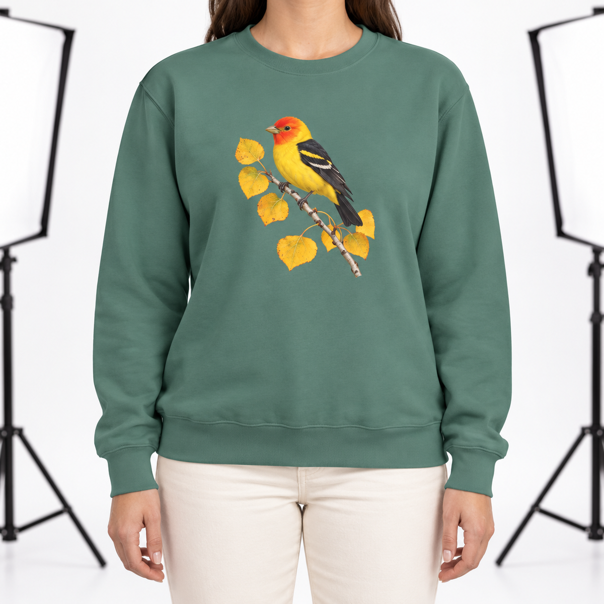 Woman wearing the Western Tanager on Golden Aspen sweatshirt in Light Green