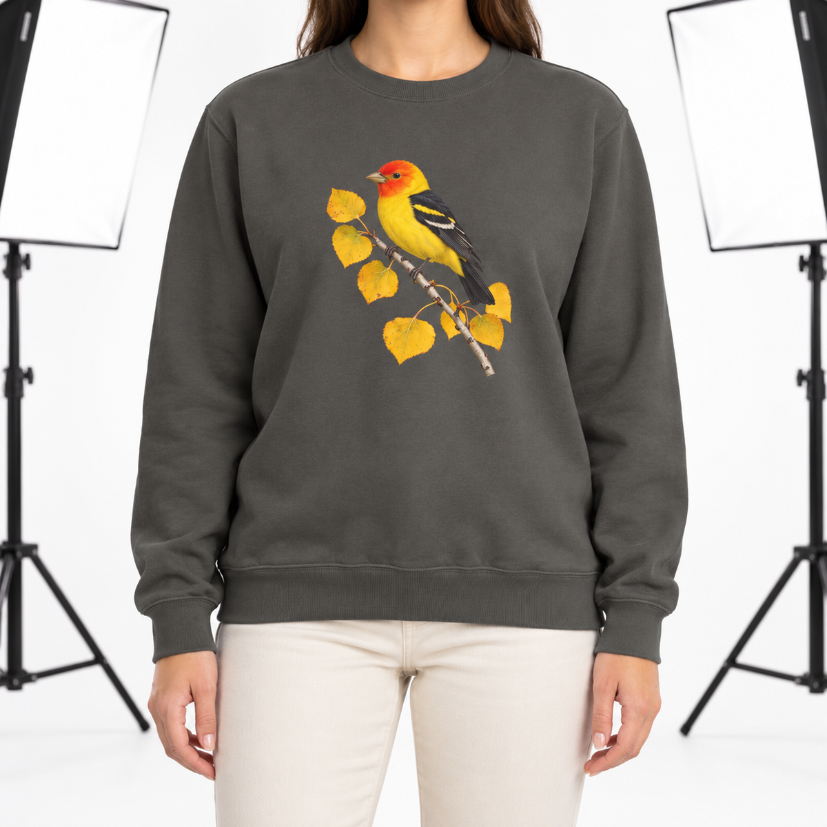 Woman wearing the Western Tanager on Golden Aspen sweatshirt in Pepper